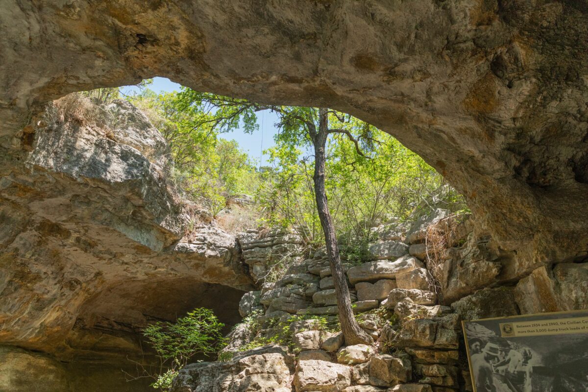 Guided tour group inside Longhorn Cavern State Park near Burnet Texas with dramatic cave formations